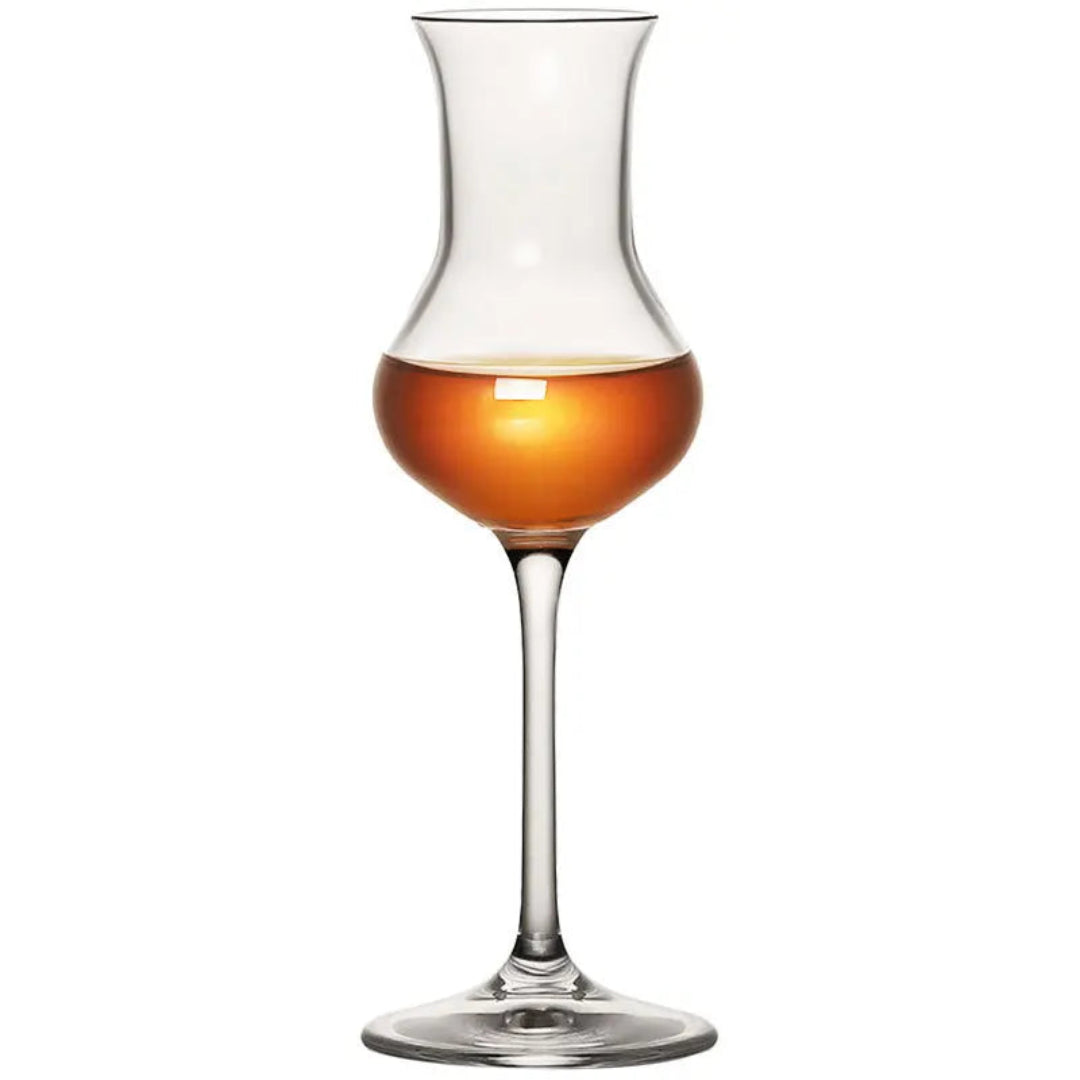 A clear glass tulip decanter filled with amber liquor, centered on a plain white background.