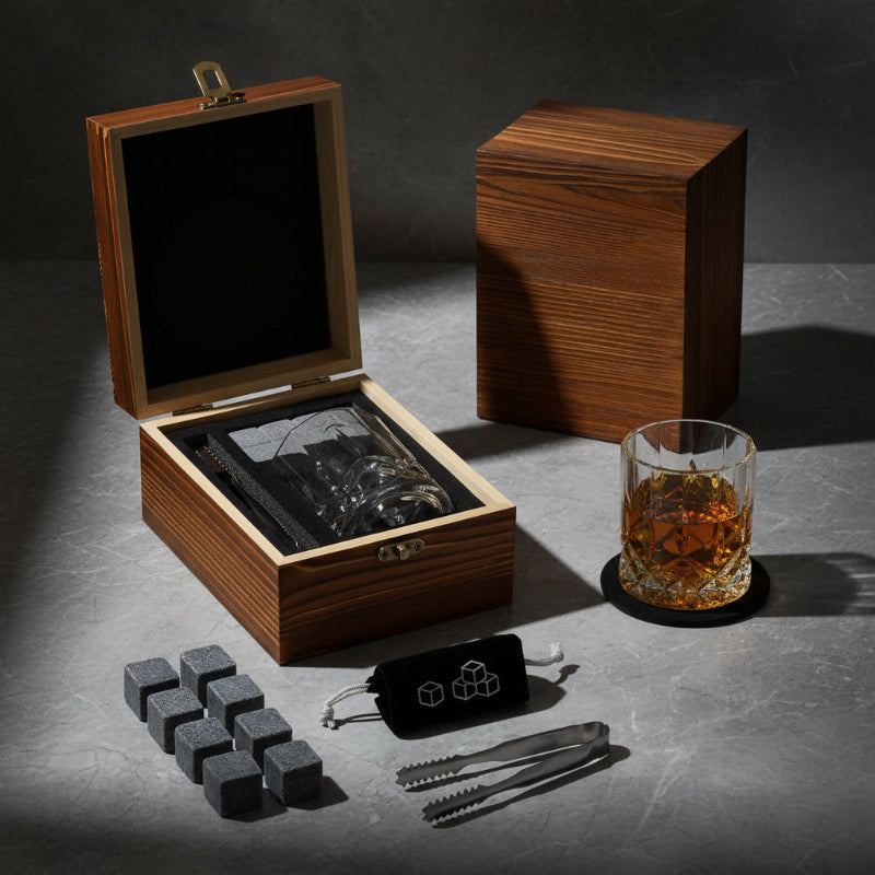 Whiskey Stones set with glass, coaster, and tools in a wooden box.