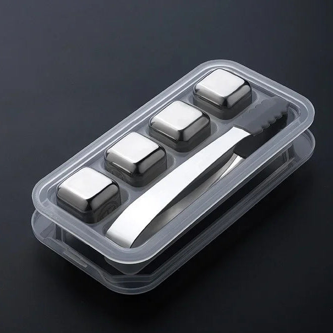 Ice cube tray with four square ice cubes and a clip on a black background