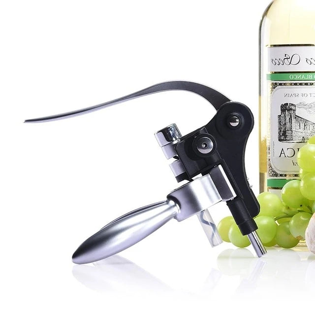 Wine opener with a bottle of white wine and grapes on a white background