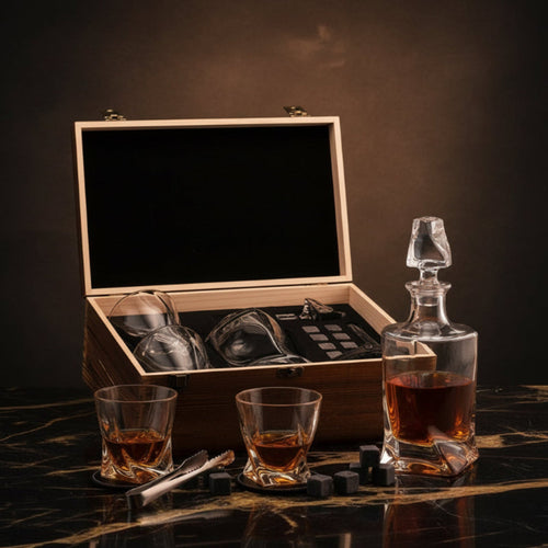 Alcohol decanter set with glasses and wooden box on a white surface